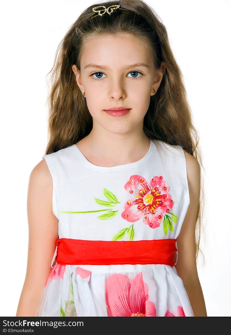 Little girl in red dress on white background