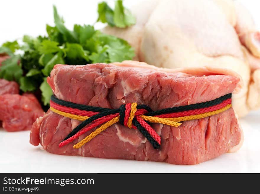 Raw beef meat with german flag ribbon. Raw beef meat with german flag ribbon