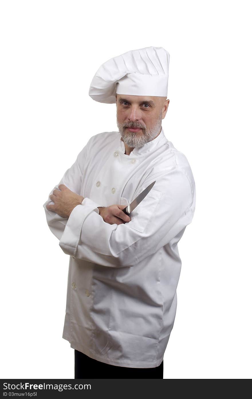 Portrait of a chef with crossed arms and a knife in a chef's hat and uniform isolated on a white background. Portrait of a chef with crossed arms and a knife in a chef's hat and uniform isolated on a white background.