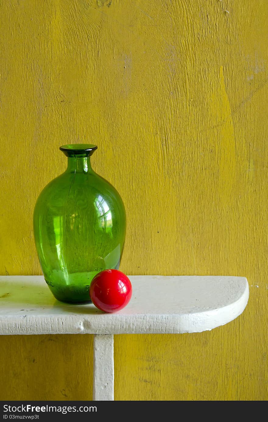 Still-life with bottle and red ball