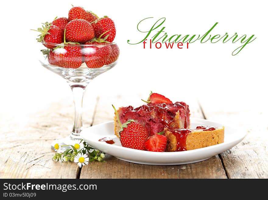 A cup of strawberries with a cake on the table with place for your text. A cup of strawberries with a cake on the table with place for your text