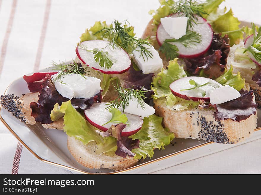 Sandwich from white bread, Salad leaves, radish, brynza