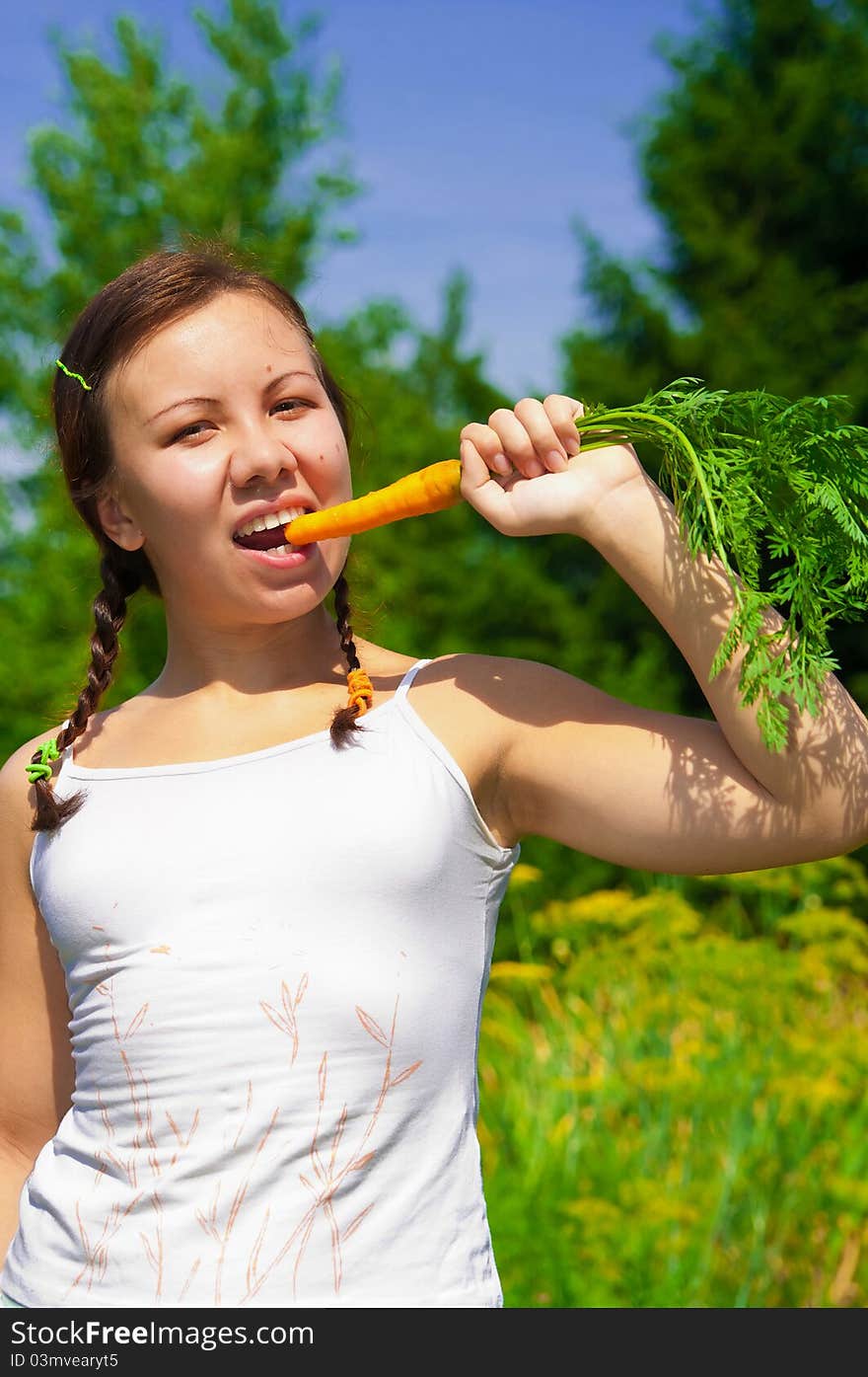 Woman eating Carrot