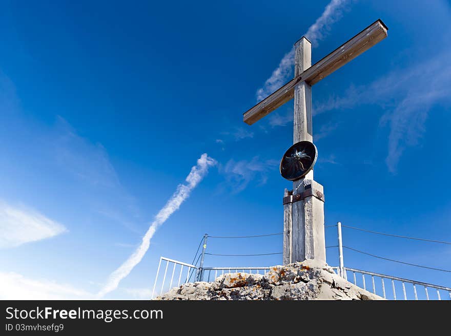 Summit cross on a blue sky of fog horn. Summit cross on a blue sky of fog horn