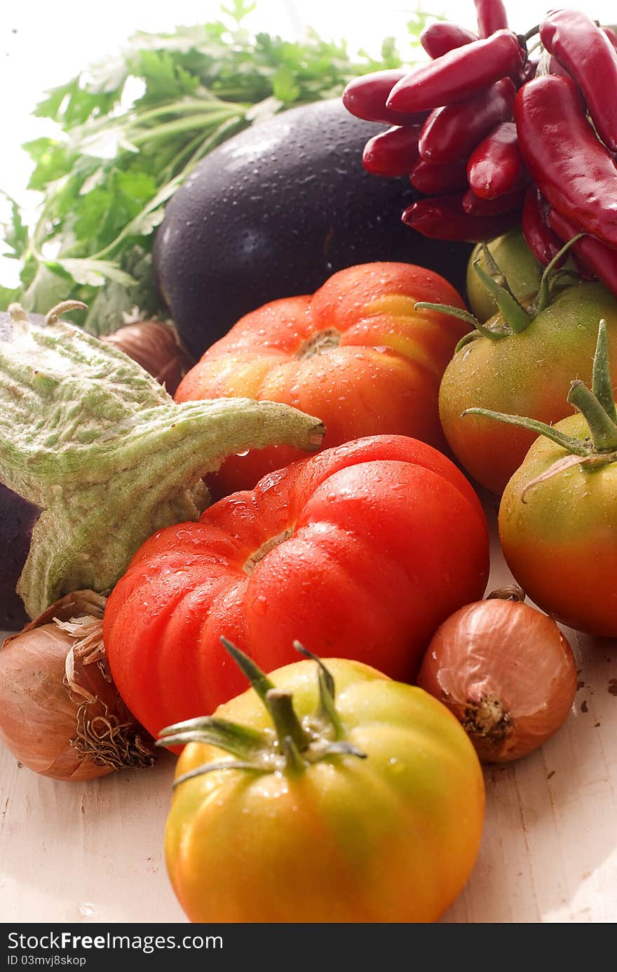 Tomatoes, onion, aubergine, parsley and chilli pepper. Tomatoes, onion, aubergine, parsley and chilli pepper