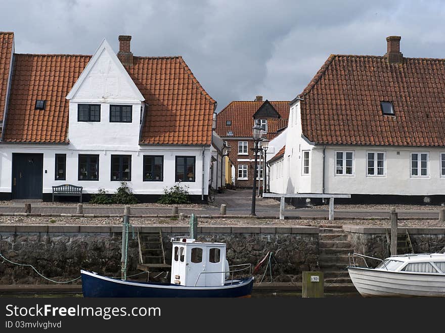 Nautical vessels and old vintage houses from Old Town Ribe in Denmark. Nautical vessels and old vintage houses from Old Town Ribe in Denmark.