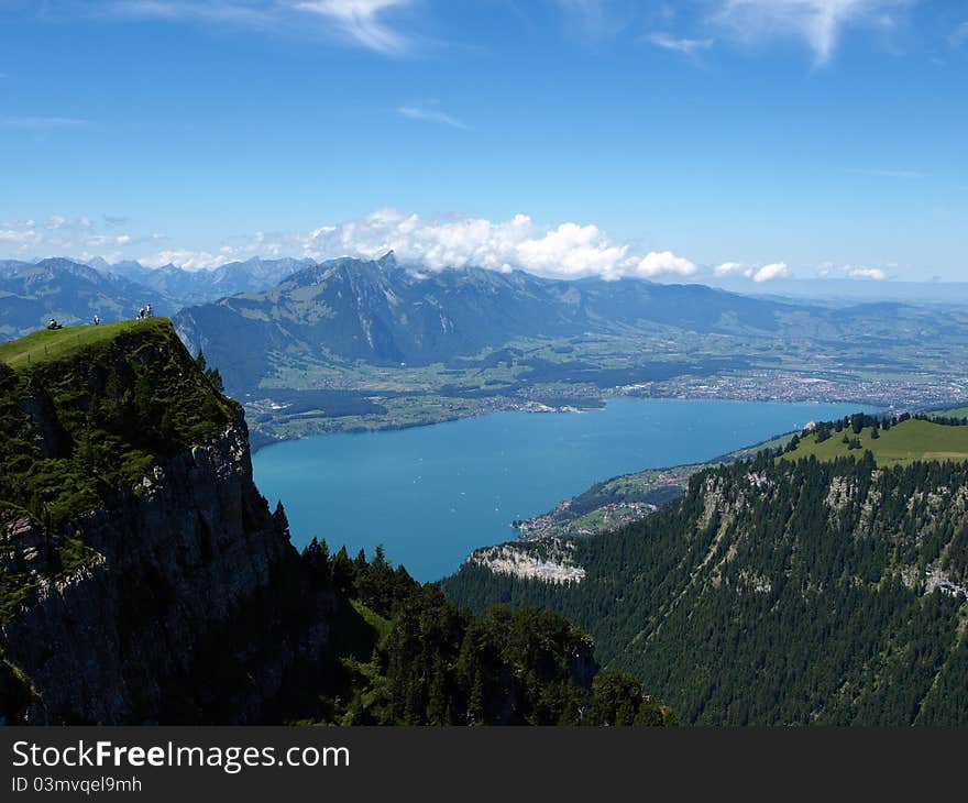 Blue lake with blue sky in green Switzerland