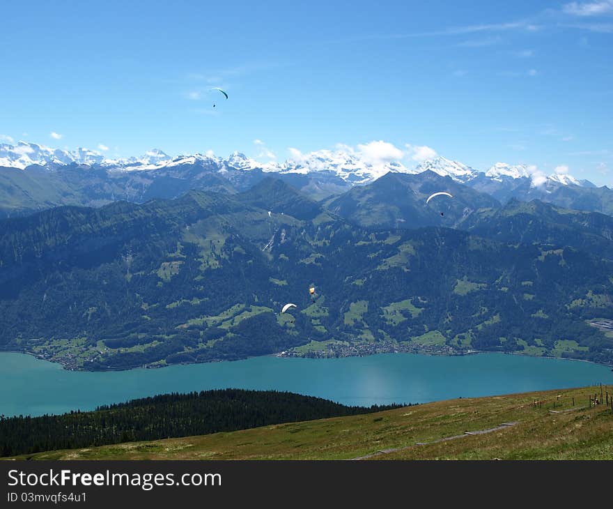 Blue lake with blue sky in green Switzerland