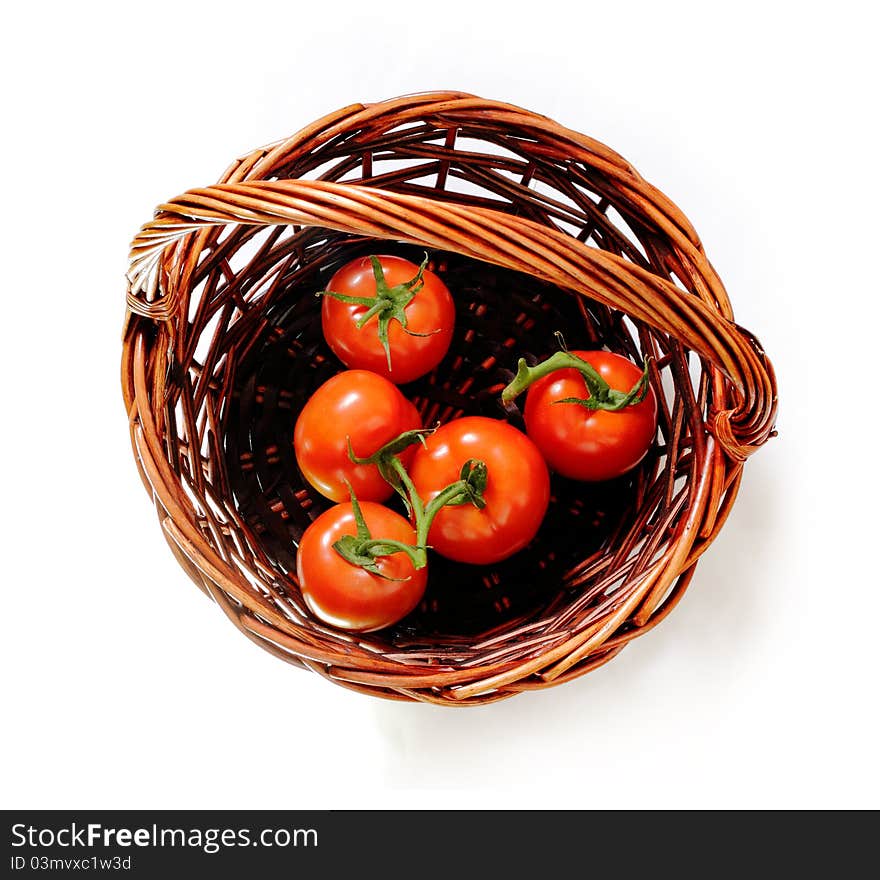 Tomatoes in the rattan basket. Top view