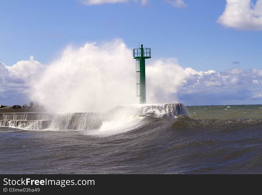 Huge wave crashed against the breakwater near the seaport