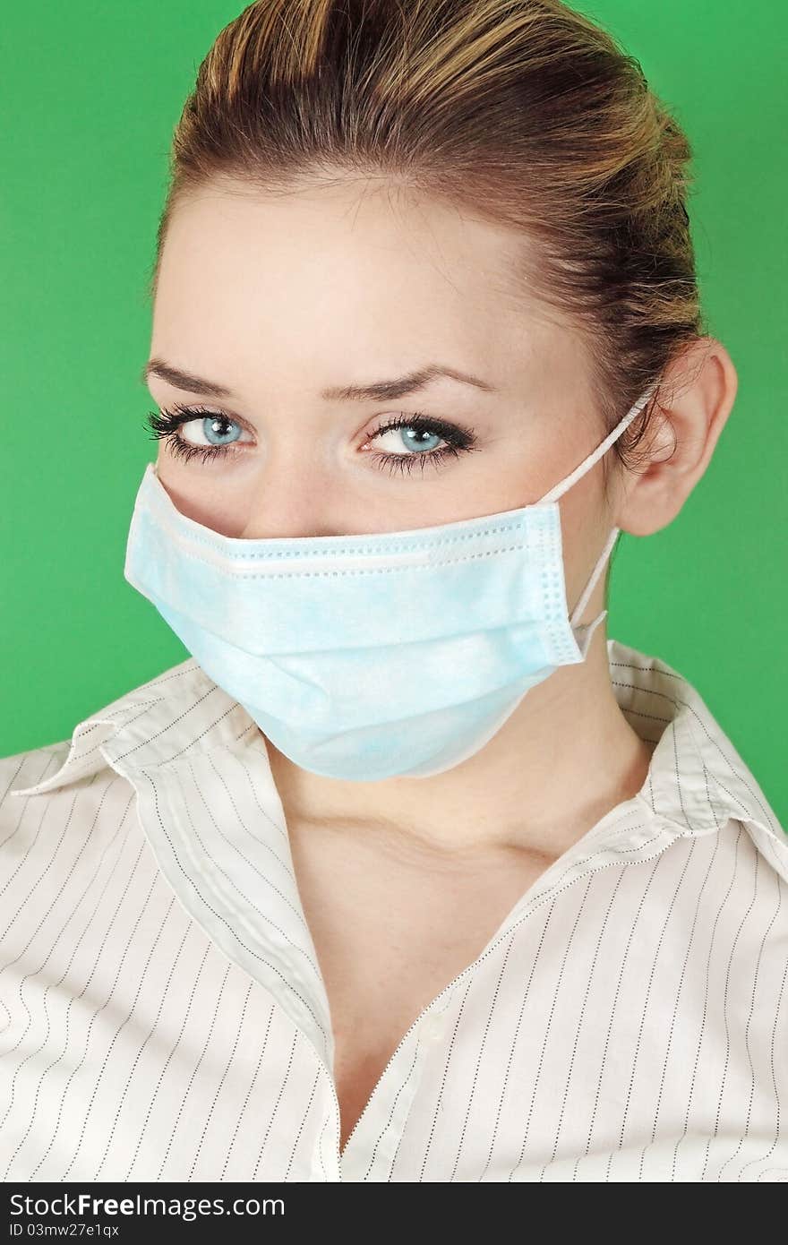 Woman in the medical bandage against the green background