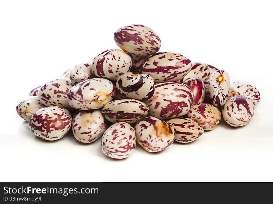 Pile of freshly harvested borlotti beans against a white background. Pile of freshly harvested borlotti beans against a white background