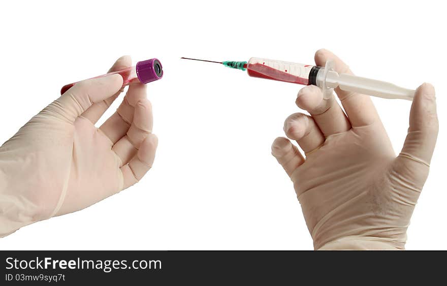 Hands in gloves holding syringe and blood container isolated on white with clipping path. Hands in gloves holding syringe and blood container isolated on white with clipping path.