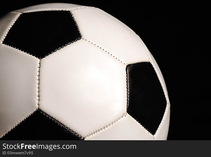 Closeup Of Football Ball On Black