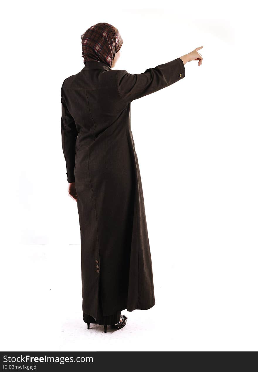 Muslim girl pointing on white background