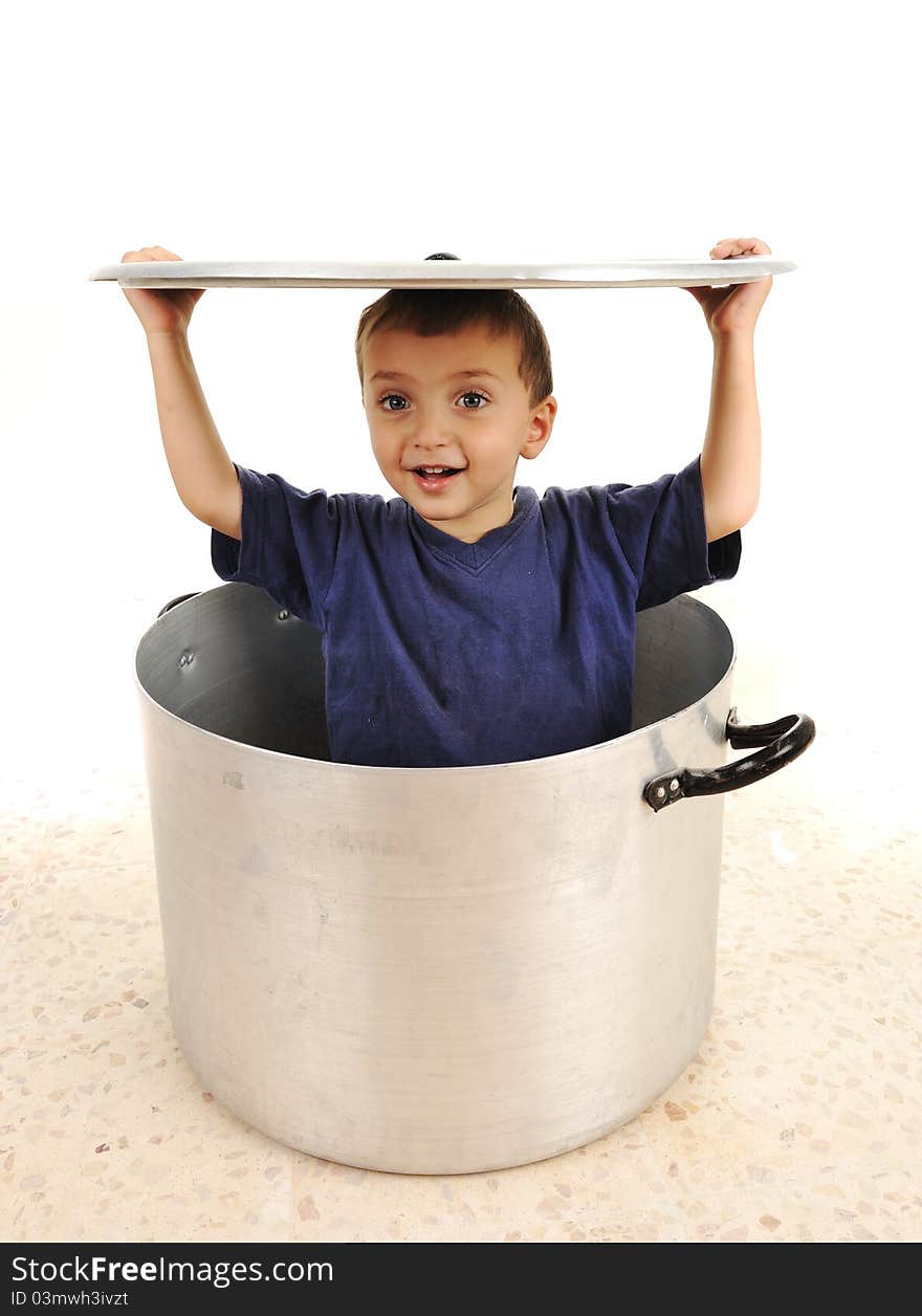 Cute child in pot, playing