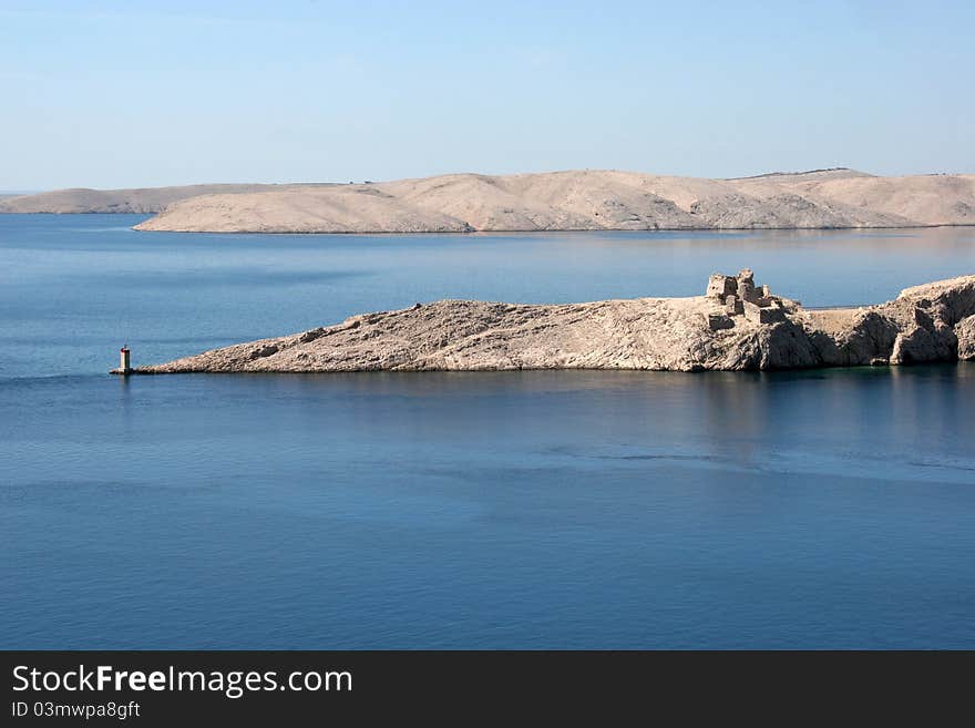 Lighthouse and the ruins of the far south point of the island Pag in Croatia