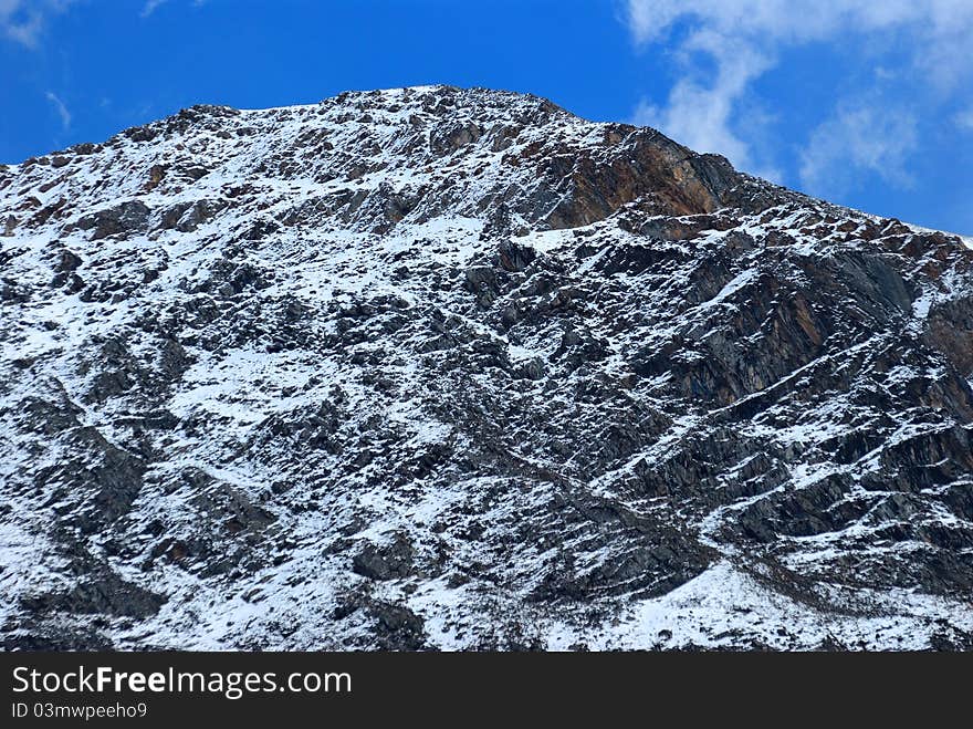 Snow mountain at blue sky background