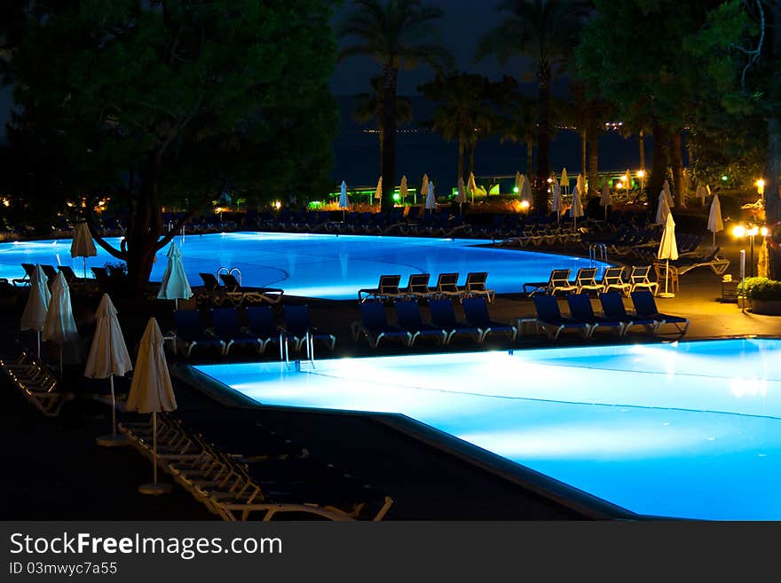 Hotel and resort swimming pool at night