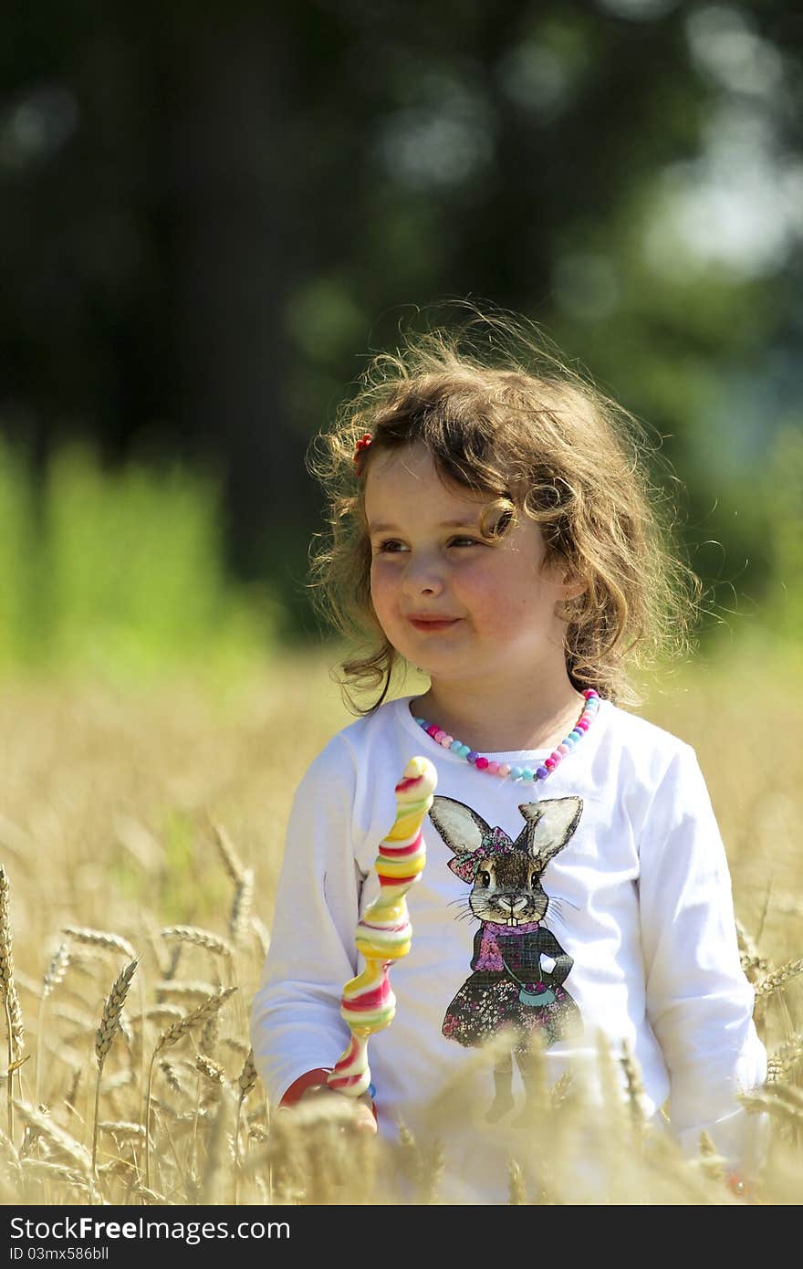 Little gilr in Field, having lollipop. Little gilr in Field, having lollipop