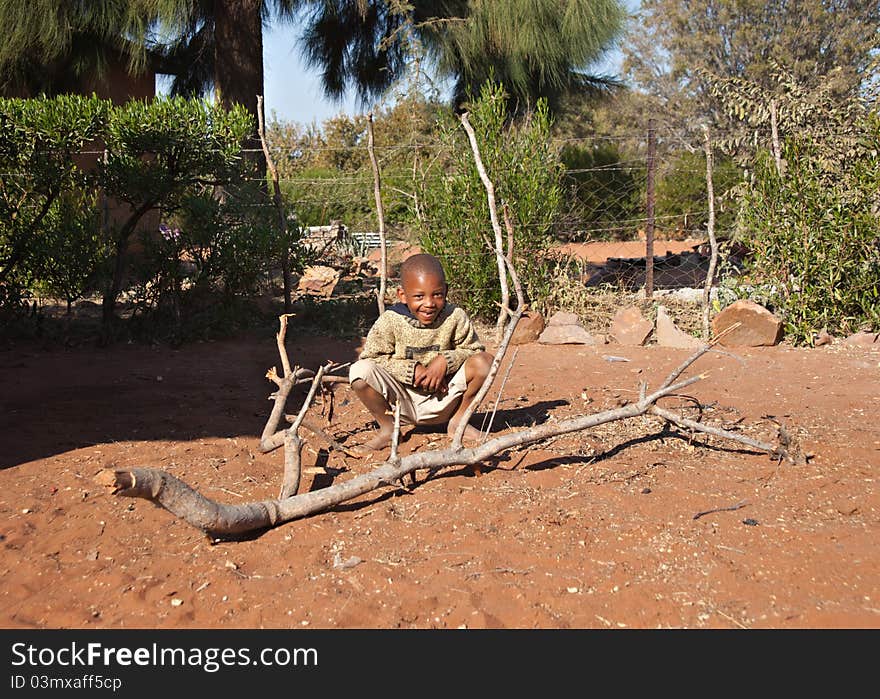 Poor African little boy playing, Mochudi village, Botswana