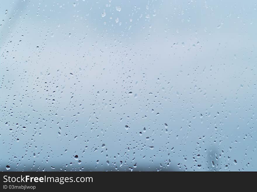 Drops of rain on the window glass. Shallow DOF