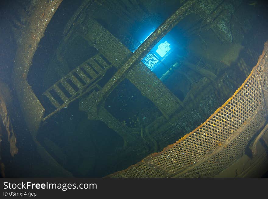 Deep inside the engine of a large underwater shipwreck. Deep inside the engine of a large underwater shipwreck