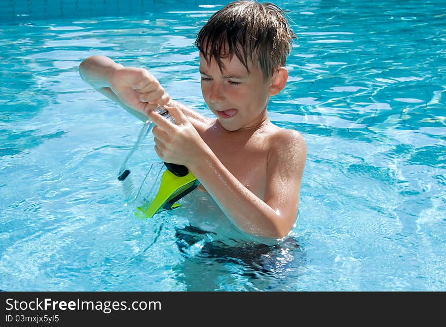 Cute Boy Adjusts Goggles