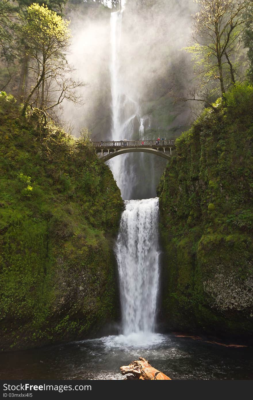 Multnomah waterfalls in Oregon with the light showcasing the mist in the air. Multnomah waterfalls in Oregon with the light showcasing the mist in the air