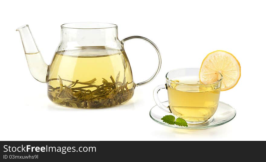 Tea in cup with leaf mint and lemon isolated on white background