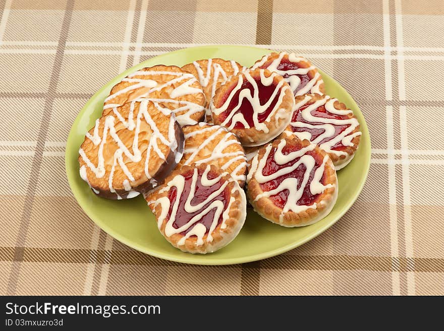 Cookies with strawberry jam on a plate