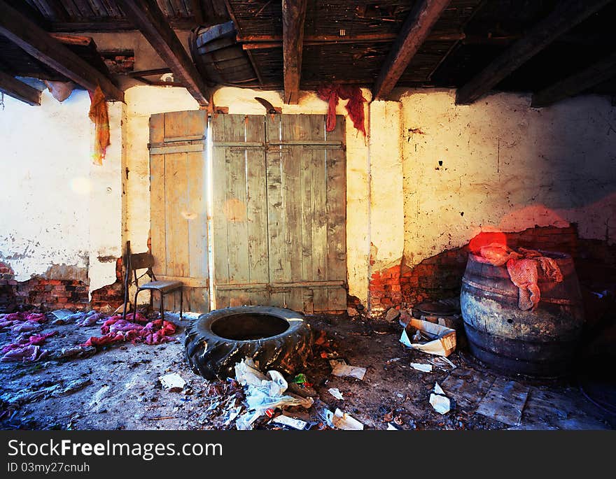 Interior of a ruined house with garbage and old ruined furniture. Interior of a ruined house with garbage and old ruined furniture.