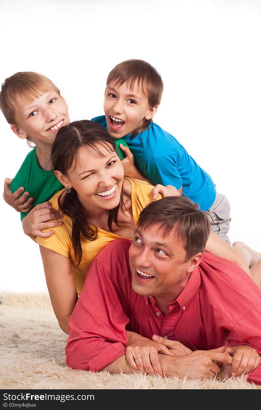 Nice family of a four on a carpet. Nice family of a four on a carpet