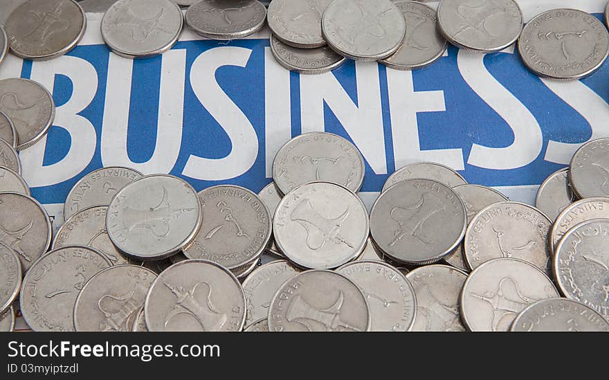 Coins On The Business Newspaper