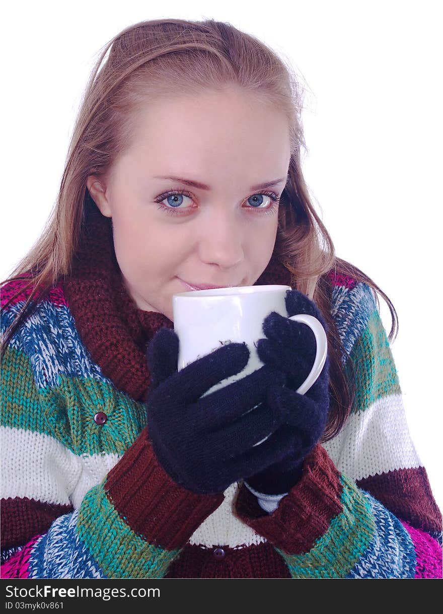 Girl in winter clothes with cup of coffee on white. Girl in winter clothes with cup of coffee on white