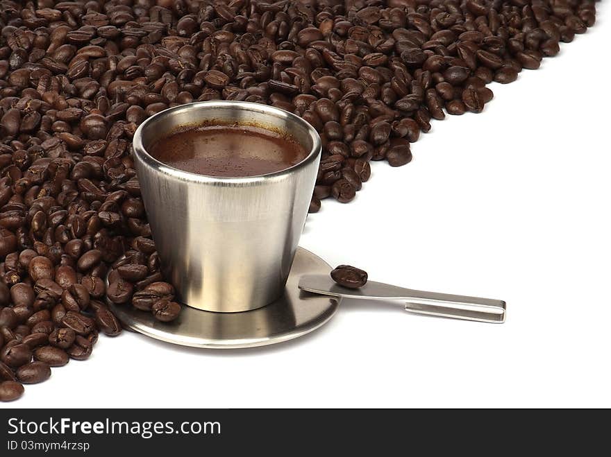 Coffee cup with coffee beans isolated on white