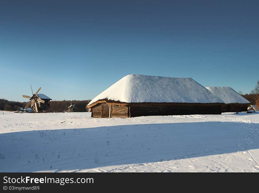 Snow on a roof of old wooden house