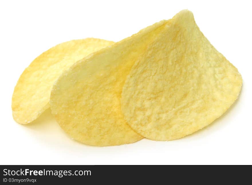 Crispy potato chips over white background