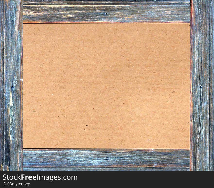 Brown cardboard in a wooden frame with space for your design. Brown cardboard in a wooden frame with space for your design