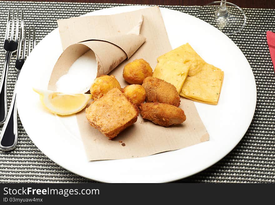 Tradional sicilian fried panelle and croquettes with salt