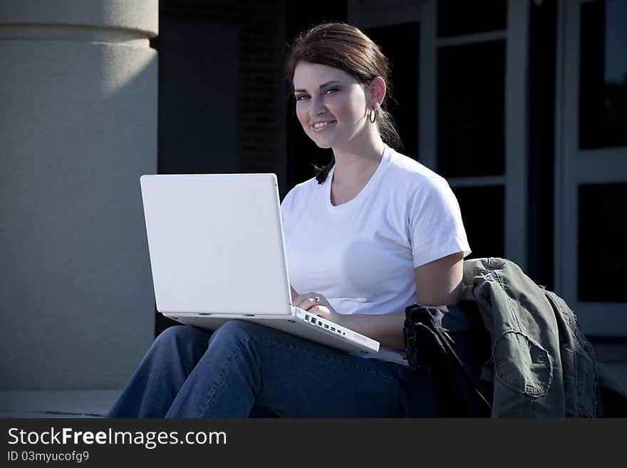 Female Student With Laptop Computer