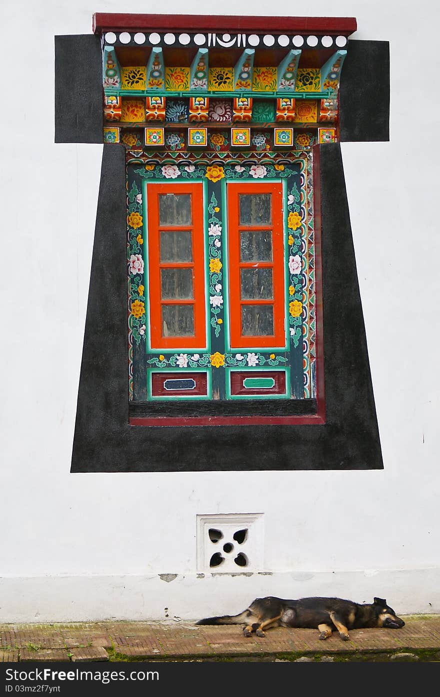 Old-styled wooden decorated Tibetan window. Sikkim. India. Old-styled wooden decorated Tibetan window. Sikkim. India