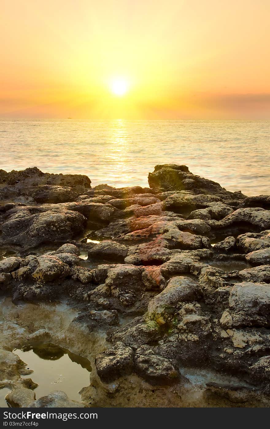 Rock in sea and blue sky.