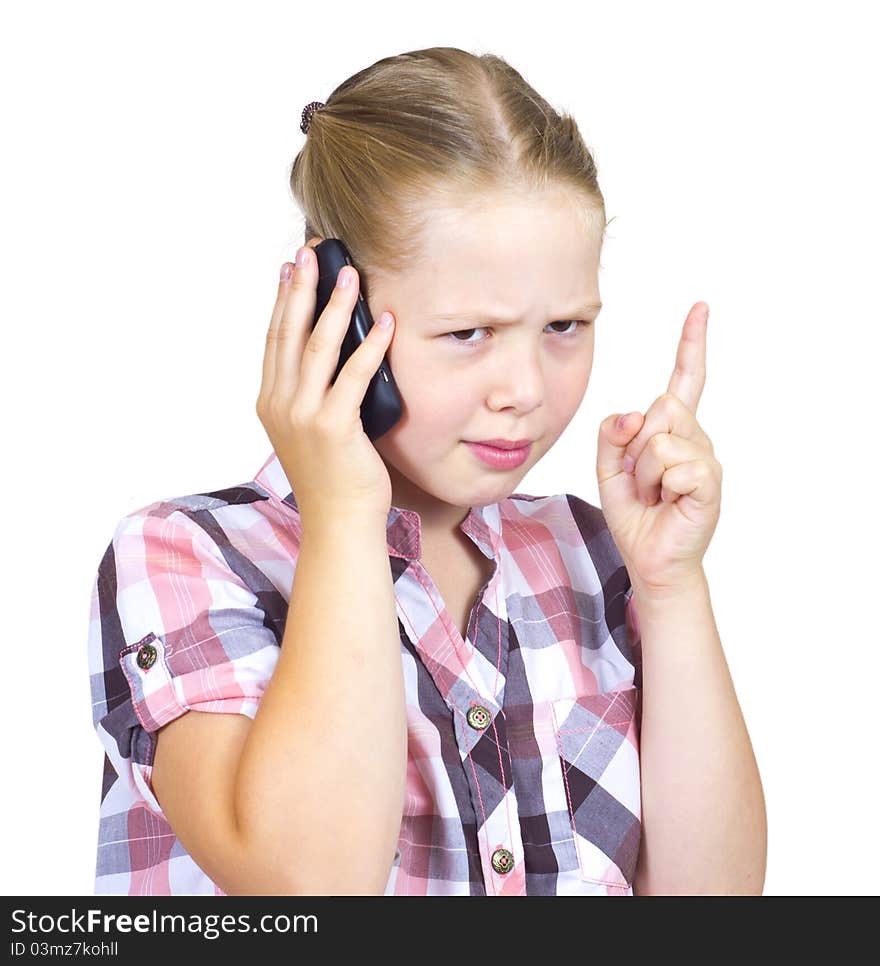 The beautiful girl with astonishment speaks on the phone. The beautiful girl with astonishment speaks on the phone