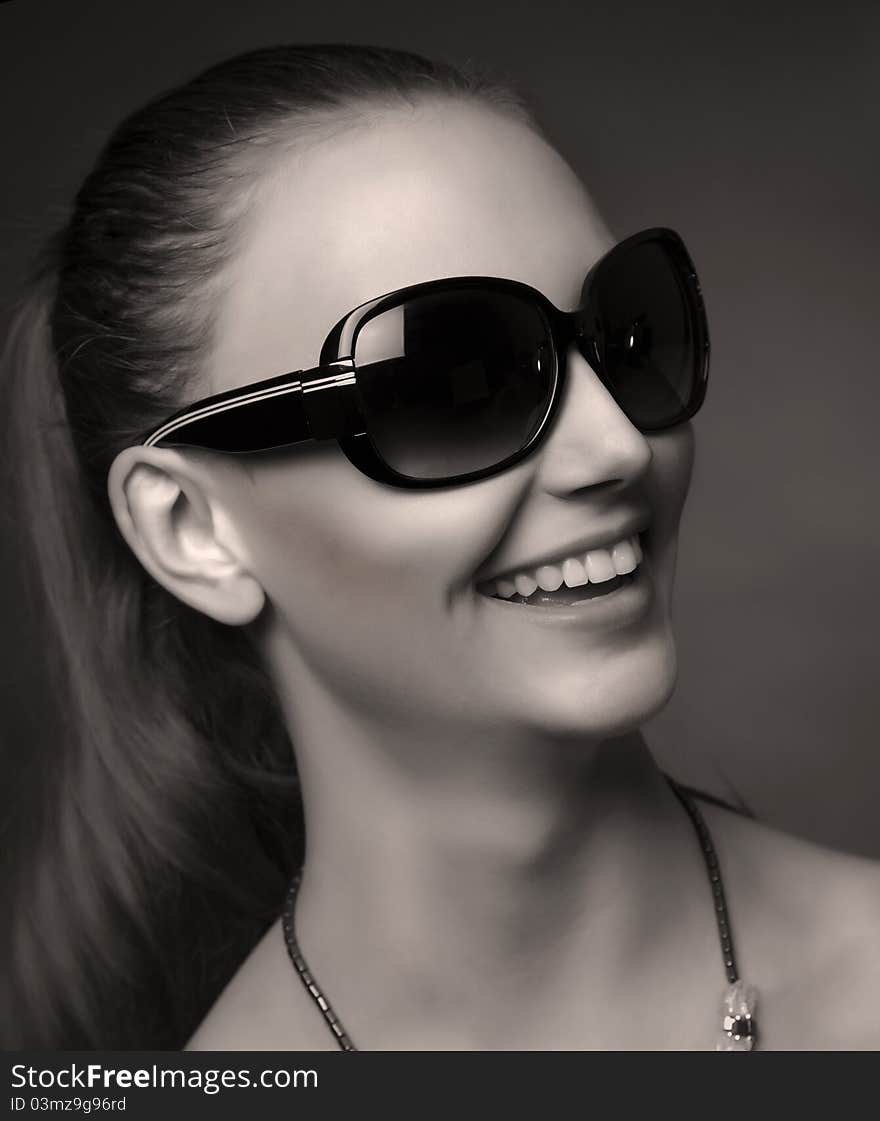 Smiling Fashionable Girl With Sunglasses