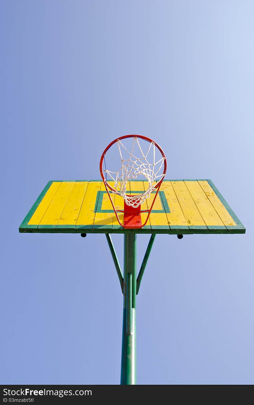 Yellow backboard on sky background