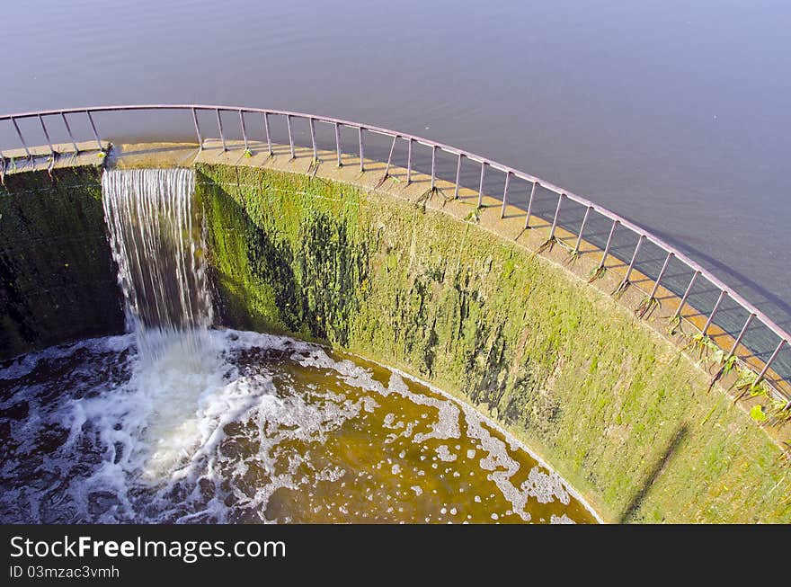 Lake dam in midsummer and morning sunlight