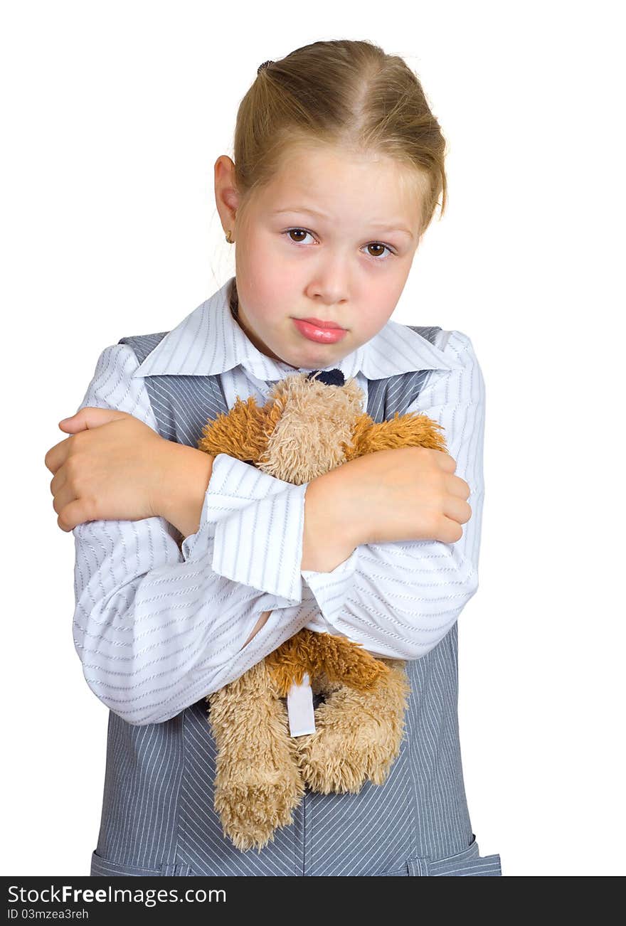 Schoolgirl with plush toy on white