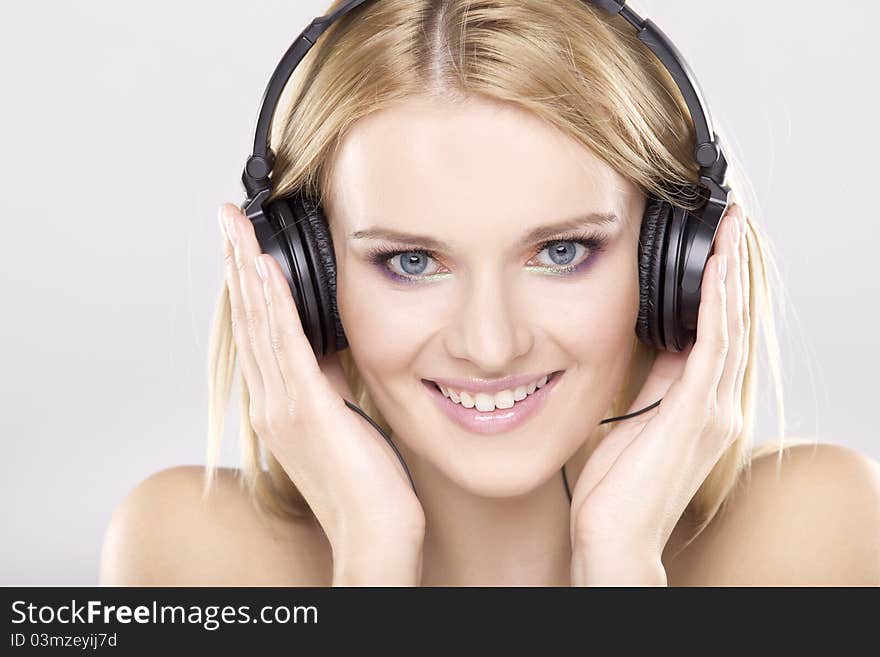 Beautiful girl is listen to the music