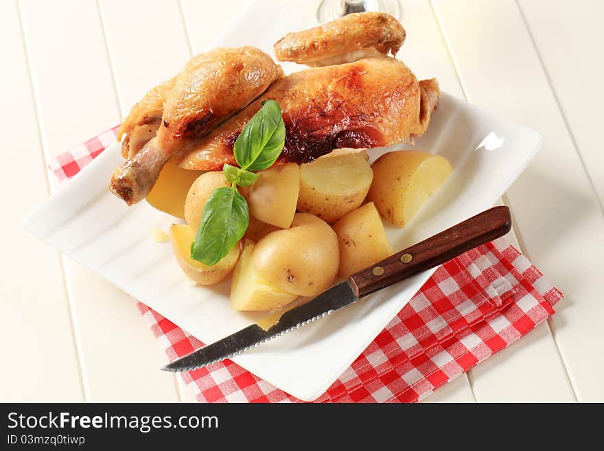 Roast chicken and new potatoes - still life. Roast chicken and new potatoes - still life